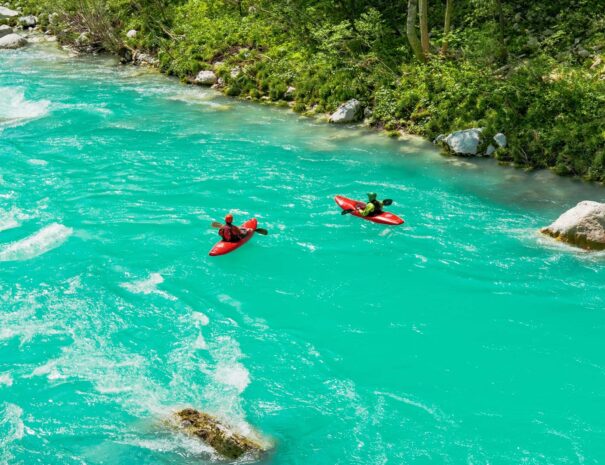 two-kayaks-on-an-emerald-river-on-a-sunny-summer-d-2025-02-13-04-13-19-utc